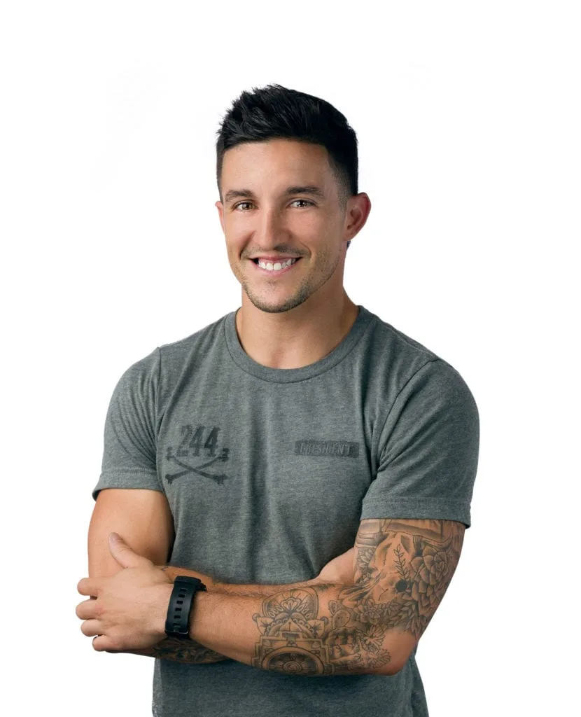 chris, gym owner and one of our trainers, standing in front of a white background